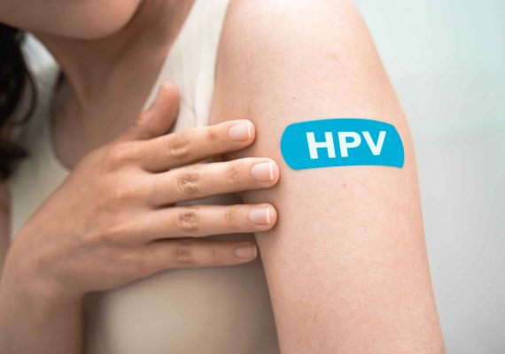 healthcare professional preparing hpv vaccine for a patient