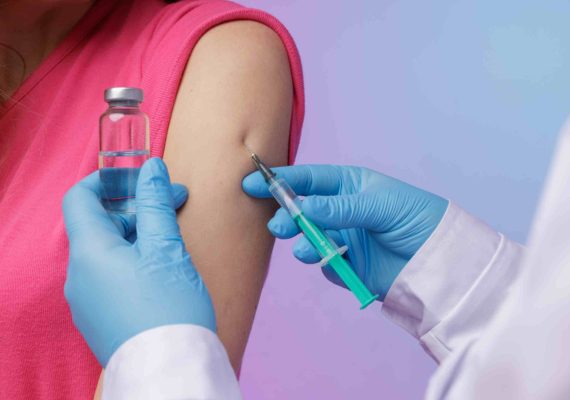 doctor explaining hpv vaccine cancer prevention benefits