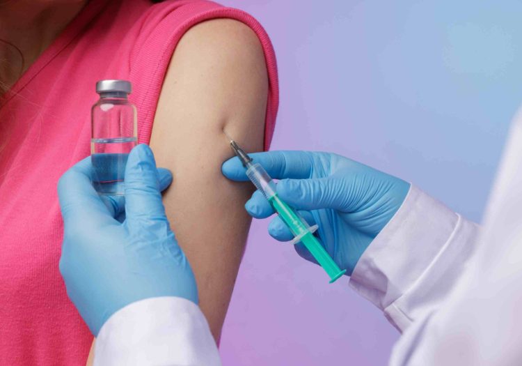 doctor explaining hpv vaccine cancer prevention benefits