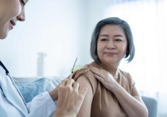 senior-woman-receiving-hepatitis-vaccination-from-healthcare-pharmacy