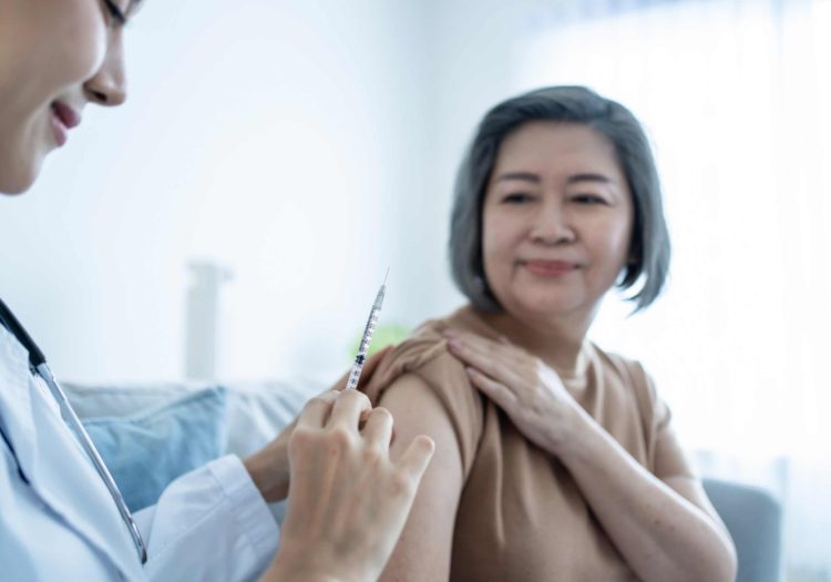 senior-woman-receiving-hepatitis-vaccination-from-healthcare-pharmacy