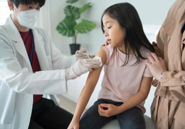 girl-receiving-DTP-vaccine-at-doctor-s-pharmacy-center