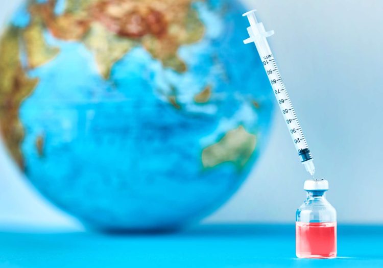 syringe-drawing-liquid-from-dtp-vaccine-near-world-globe