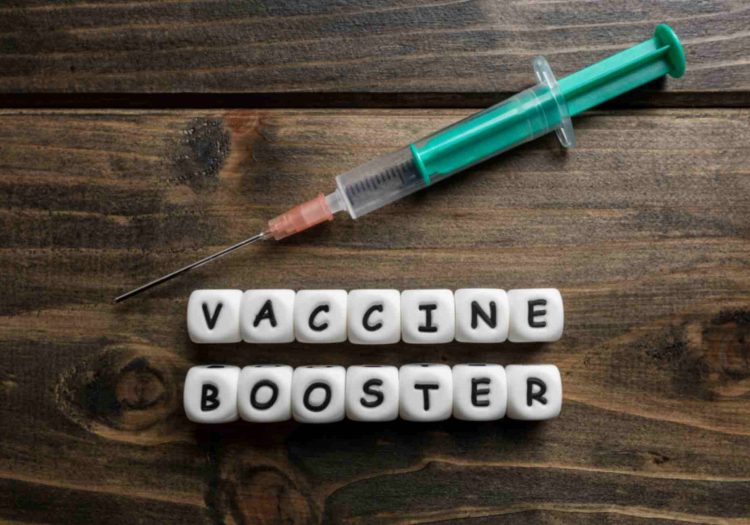 syringe-and-booster-doses-on-a-rustic-table